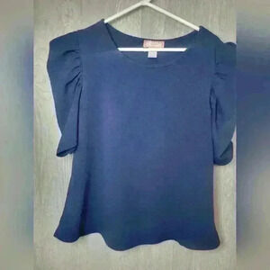 C'est La Vie navy blue blouse with puffy sleeves.